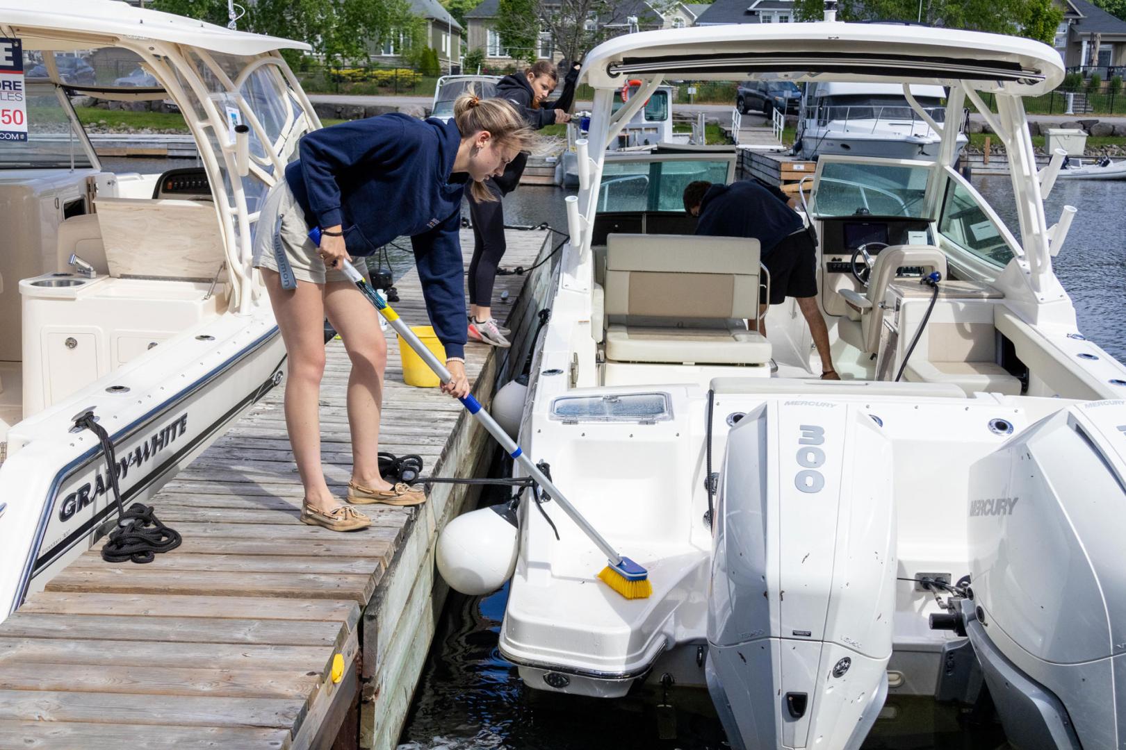 Staff working on a boat at Bay Port YC